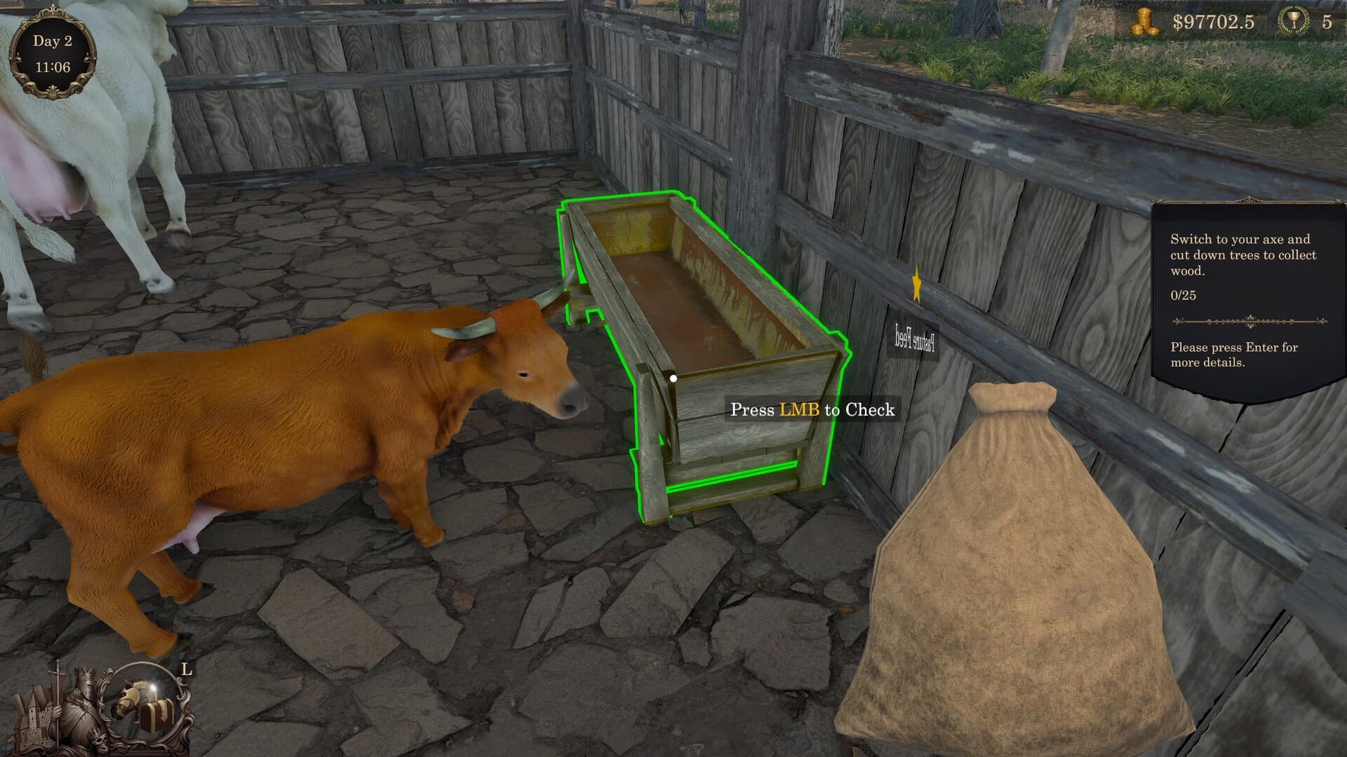 A goat stands beside a highlighted feeder inside a wooden enclosure.